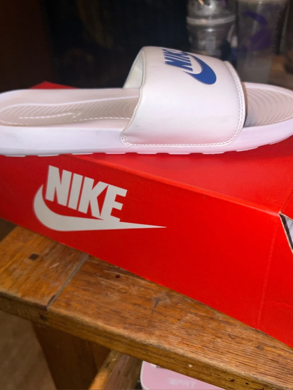 Nike White Slide Sandals with Blue Swoosh